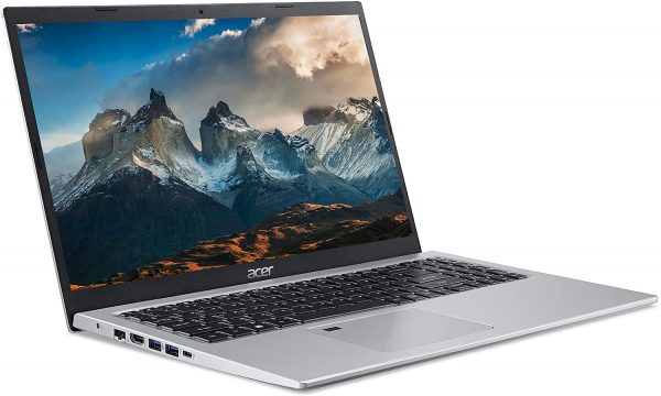 The screen of the open Acer Aspire 5 A515 laptop showcases a stunning mountain landscape. Featuring a black keyboard and a silver palm rest area, several ports can be seen on its left side.